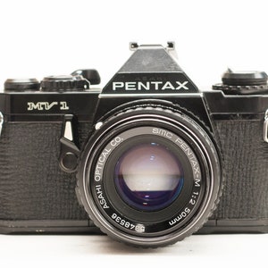 Pentax MV1  Film Camera with SMC Pentax-M 50mm f/2 .