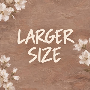 May include: A textured brown background featuring white floral illustrations in the top left and bottom right corners, with the text LARGER SIZE printed in a bold, off-white, hand-lettered font centered in the middle of the image.
