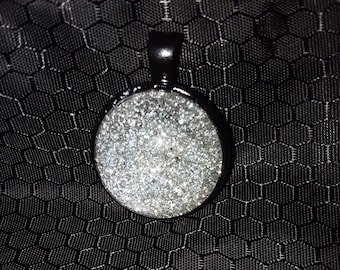 Black tone pendant with silver sparkle center