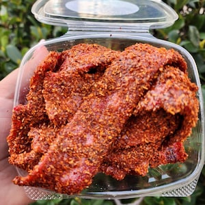 Chile Chamoy Dulces: Chile strawberry belts coated in chamoy and spice mix gummies