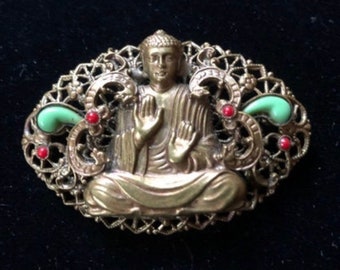 Vintage Czech Oval Gablonz unsigned Buddha brooch. Similar to Max Neiger with 4 red & 2 green cabochon’s