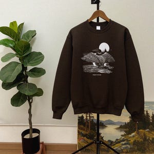 Suéter retro con cuello redondo y estampado de colimbo - Suéter vintage con aves acuáticas