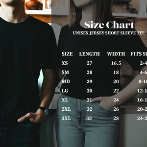 May include: Size chart for a unisex jersey short sleeve tee. The chart shows the size, length in inches, width in inches, and the corresponding size it fits in UK sizes.