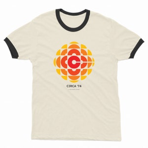 CBC 1974 ロゴ リンガー T シャツ、CBC レトロ ジェム レディース T シャツ、CBC クラシック ロゴ ユニセックス T シャツ、リンガー T シャツ、ナチュラル カラー リンガー T シャツ