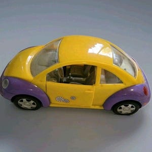 Auto de Barbie:Volkswagen New Beetle rose.Neuve,dans sa boîte scellée