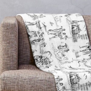 May include: Black and white illustration of a variety of people and objects, including a man with a sword, a woman with a bird, and a group of people dancing. The illustration is in a vintage style and is perfect for a throw blanket.