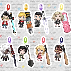 Puede incluir: Un conjunto de 10 llaveros coloridos con varios personajes y objetos, incluyendo una espada, una pala, un bate de béisbol, un teléfono y un taladro. Los llaveros están diseñados en un estilo pixelado y tienen una estética de dibujos animados.