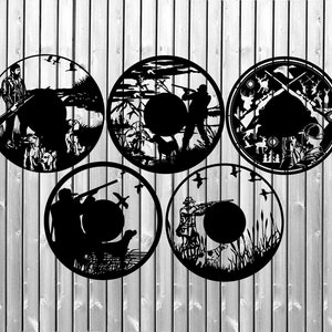 May include: Five black metal wall clocks with a hunting theme. Each clock features a silhouette of a hunter with a gun and a dog, surrounded by trees and birds. The clocks are circular and have a rustic design.