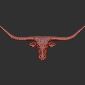 May include: A red, 3D printed bull head with large horns. The horns are curved and point upwards.