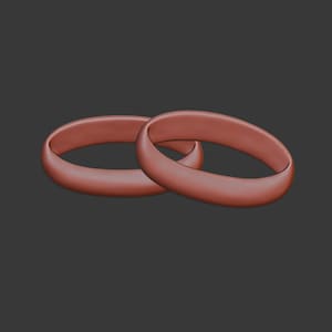 May include: Two reddish-brown rings, possibly wedding bands, are displayed against a dark gray background. The rings are smooth and have a rounded shape. The rings are slightly overlapping, suggesting a connection or relationship.