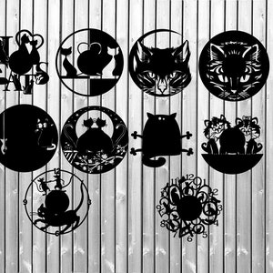 May include: A set of ten black and white cat-themed wall decor pieces. The designs include a clock, a cat with a heart, a cat with a fish, a cat with a mouse, a cat with a ball of yarn, a cat with a butterfly, a cat with a flower, a cat with a star, a cat with a moon, and a cat with a sun.