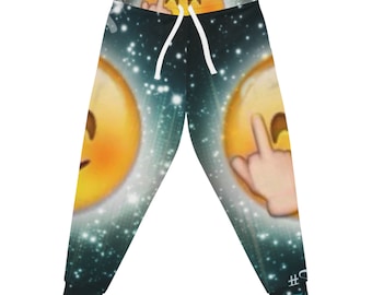May include: Jogger pants with a vibrant design featuring yellow emoji faces with hand gestures against a starry, teal background. The pants have a white drawstring and black cuffs. The text "#9" is visible on the lower right leg.