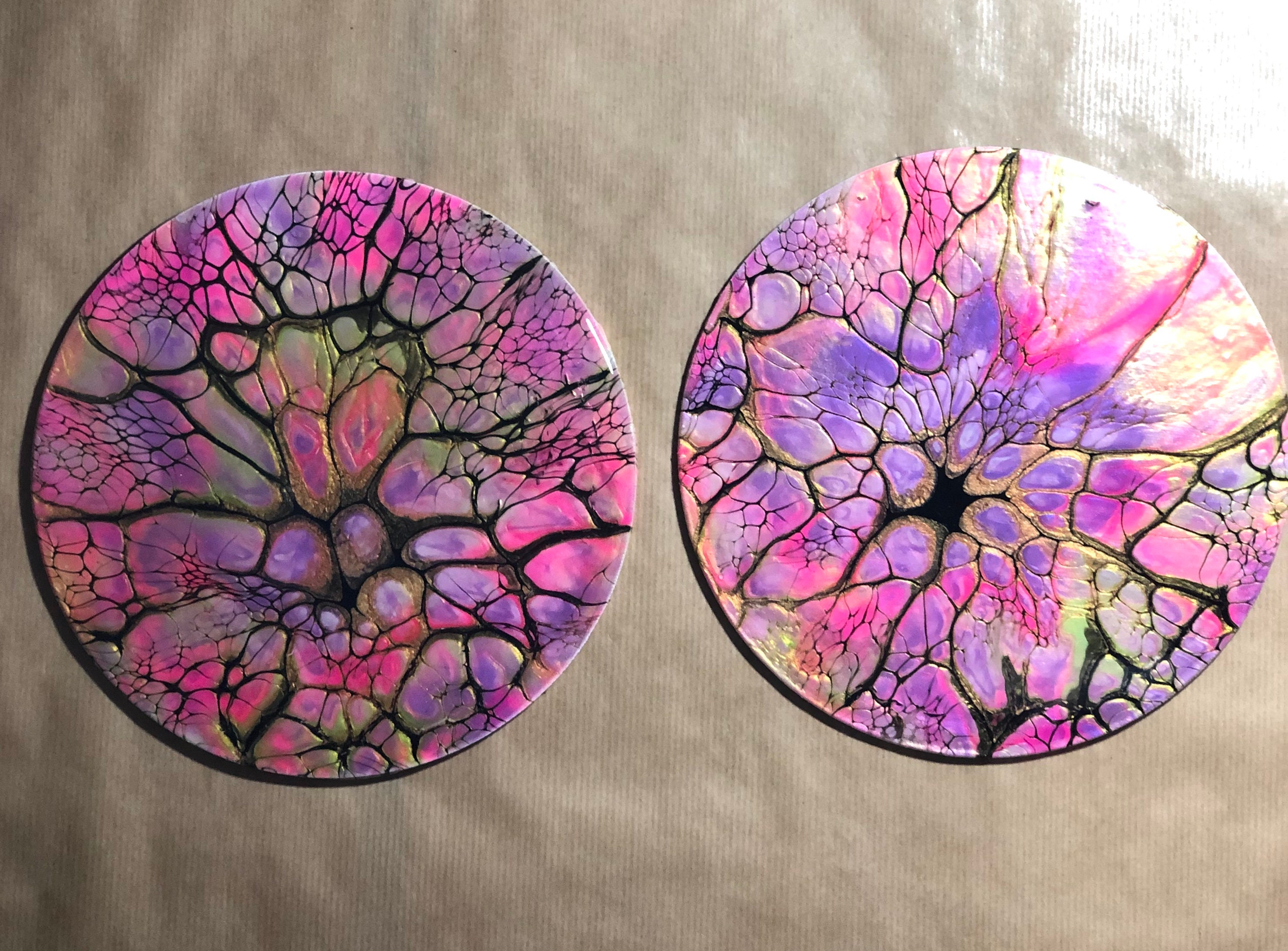 Unique coasters in shades of pink, purple and gold.