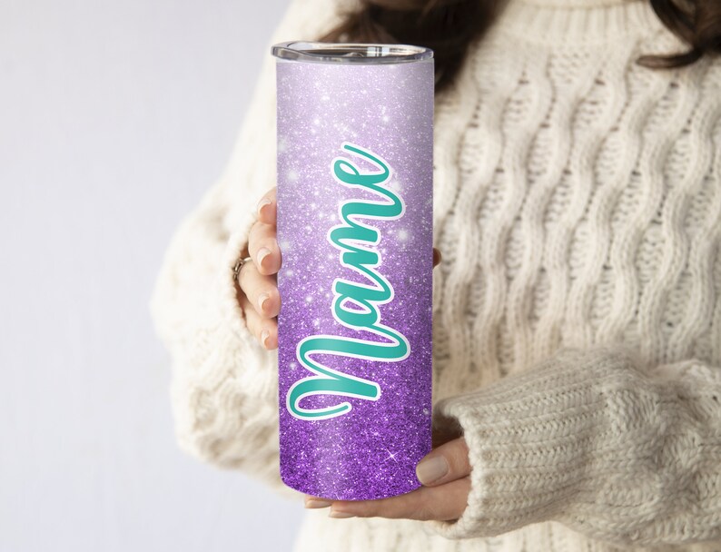 May include: A purple and white glitter tumbler with the word "Mom" written in teal.