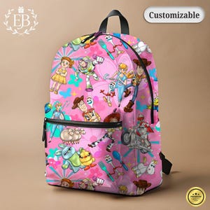 May include: Pink backpack featuring a colorful pattern of Toy Story characters. The backpack has a black zipper, handle, and straps. The word "Customizable" is printed on a white label.