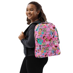 May include: A pink backpack featuring various Toy Story characters in a repeating pattern. The backpack has black straps and a black handle. The characters include Woody, Buzz Lightyear, and Jessie.
