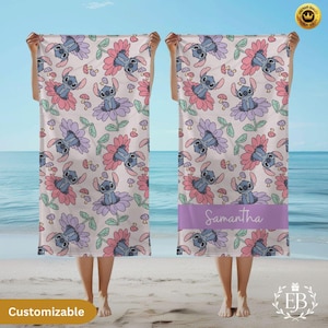 May include: A beach towel with a repeating pattern of a cartoon character in a flower design. The towel has a light background with pink, purple, and green accents. The word "Samantha" is printed on a purple band.