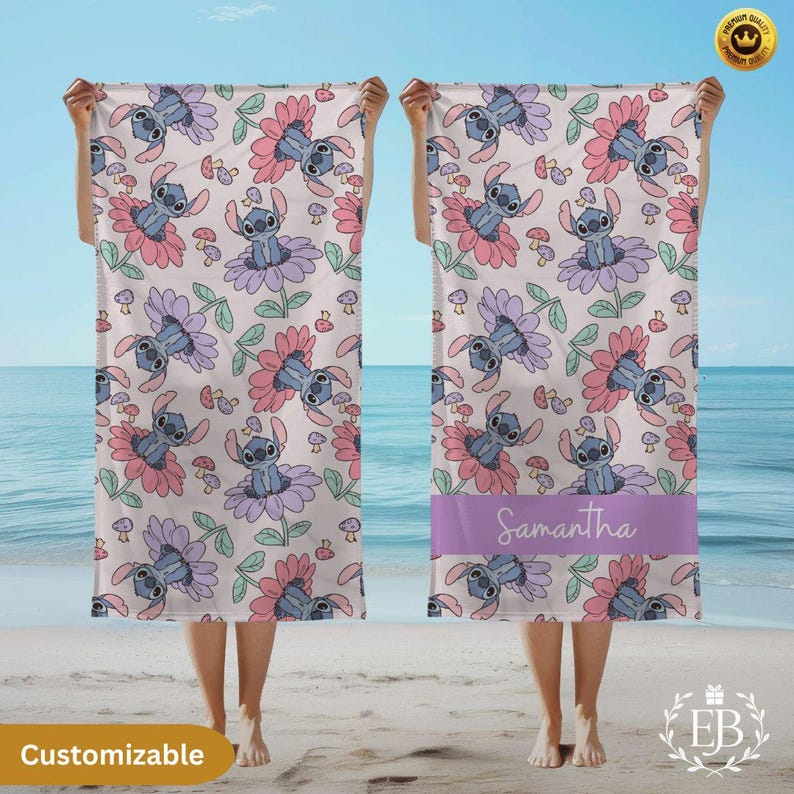 May include: A beach towel with a repeating pattern of a cartoon character in a flower design. The towel has a light background with pink, purple, and green accents. The word "Samantha" is printed on a purple band.