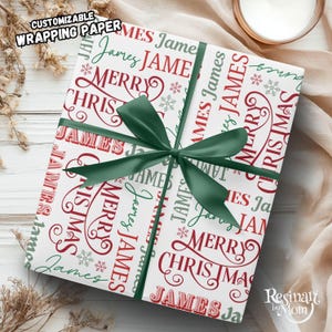 May include: White wrapping paper with a repeating pattern of the name "James" and the words "Merry Christmas" in red and green. A green ribbon is tied around the gift. The text "Customizable Wrapping Paper" is at the top.