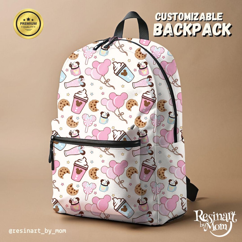 May include: White backpack with a pattern of pink balloons, cookies, ice cream, and coffee cups. The backpack has a black zipper and straps, with the text "CUSTOMIZABLE BACKPACK". A gold seal with the words "PREMIUM QUALITY" is in the upper left corner.