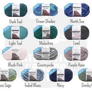 May include: Assortment of Bernat Blanket yarn in various colors, including teal, green, blue, pink, and gray. Each skein is labeled "NEW" and features the Bernat Blanket logo.