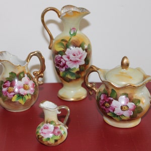 Tea Set, Miniature Sugar, Creamer, water vase, and smaller water vase marked Enesco Japan E2351 marked on all pieces.