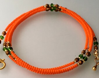 Taillekralen oranje rocaille – gouden sluiting, buikketting