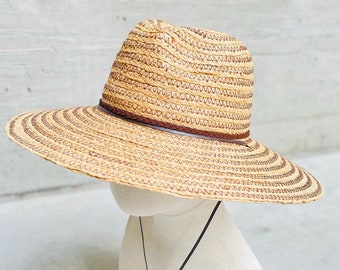 Best Seller! Premium quality straw hat. Hand woven hat with wide brim hat. Finished with a wide chin tie made of Faux Leather ribbon.