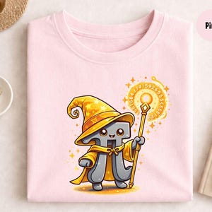 May include: A light pink sweatshirt with a cartoon Pi symbol dressed as a wizard, wearing a yellow hat, cape, and holding a staff. The design includes a glowing circle with numbers. The word "Pink" is in a pink circle.