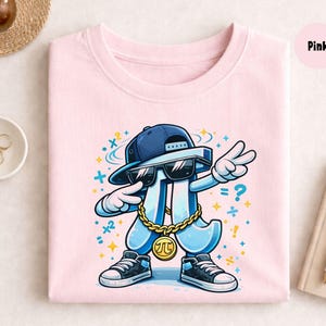 May include: Pale pink crew neck t-shirt with a cartoon Pi symbol character wearing sunglasses, a blue cap, and trainers. The character is making a peace sign and a dab. The shirt has math symbols and a gold chain.