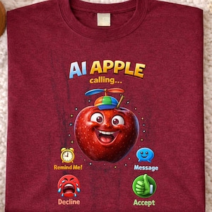 May include: Maroon t-shirt with the text "AI APPLE calling..." and a cartoon apple character with a propeller hat. The shirt features icons for "Remind Me!", "Message", "Decline", and "Accept".