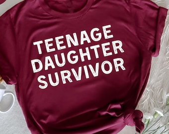 Camiseta de superviviente de hija adolescente, padres de adolescentes, humor sobre la crianza de un adolescente, camiseta divertida, camiseta divertida y relatable, humor y fuerza