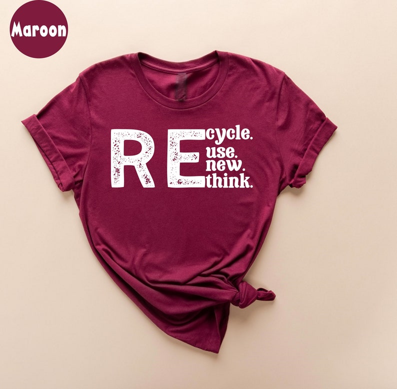 May include: A maroon t-shirt with a white graphic that says "REcycle. use. new. think."