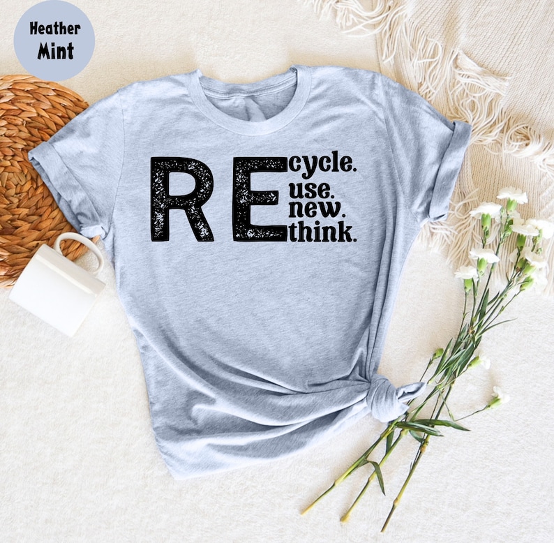 May include: Heather mint grey t-shirt with a black graphic that says "REcycle. use. new. think."