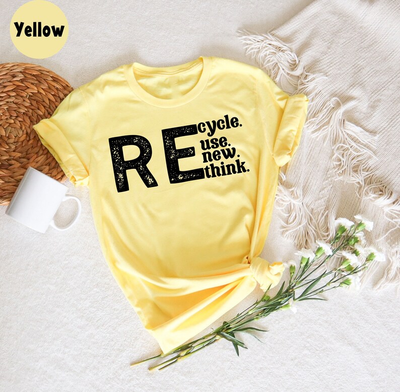 May include: Yellow t-shirt with a black graphic that says "REcycle. use. new. think."