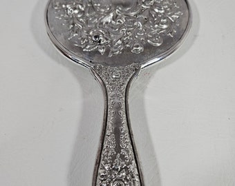 Vintage silver plate decorative cherub hand held mirror