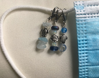 Blue and silver mask/zipper charms