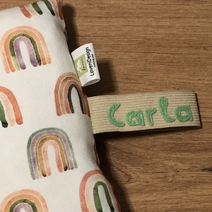 Optional name loop for seat cushion, reading bone, cuddly pillow