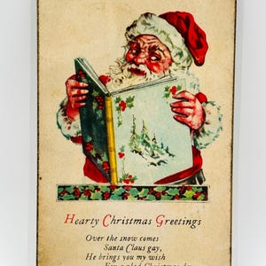 Vintage kerstkaart uit 1925 "Hartelijke kerstgroeten, over de sneeuw komt de kerstman homo, hij brengt je mijn wens voor een fijne kerstdag