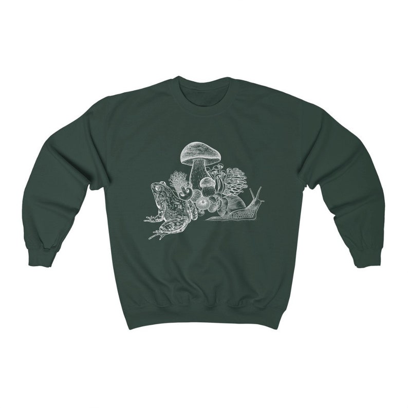 May include: A dark green sweatshirt with a white illustration of a frog, snail, and mushrooms.