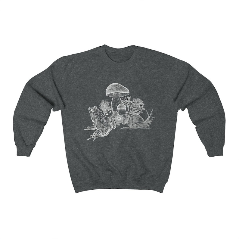 May include: A dark heather grey sweatshirt with a white graphic of a frog, snail, and mushrooms.