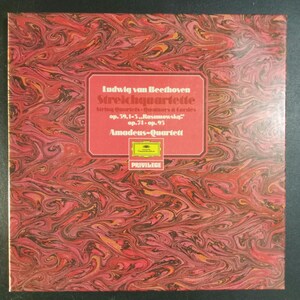 May include: A vinyl record album cover with a red and brown marbled design. The album title, "Ludwig van Beethoven Streichquartette," is displayed in white text on a red rectangular label. The label also includes the text "Amadeus-Quartett" and "PRIVILEGE."