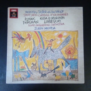 May include: A vintage vinyl record album cover featuring a colorful, childlike illustration. The artwork depicts a boy riding a wolf, with various animals and a rainbow. The album title is "Peter and the Wolf" and "Carnival of the Animals".