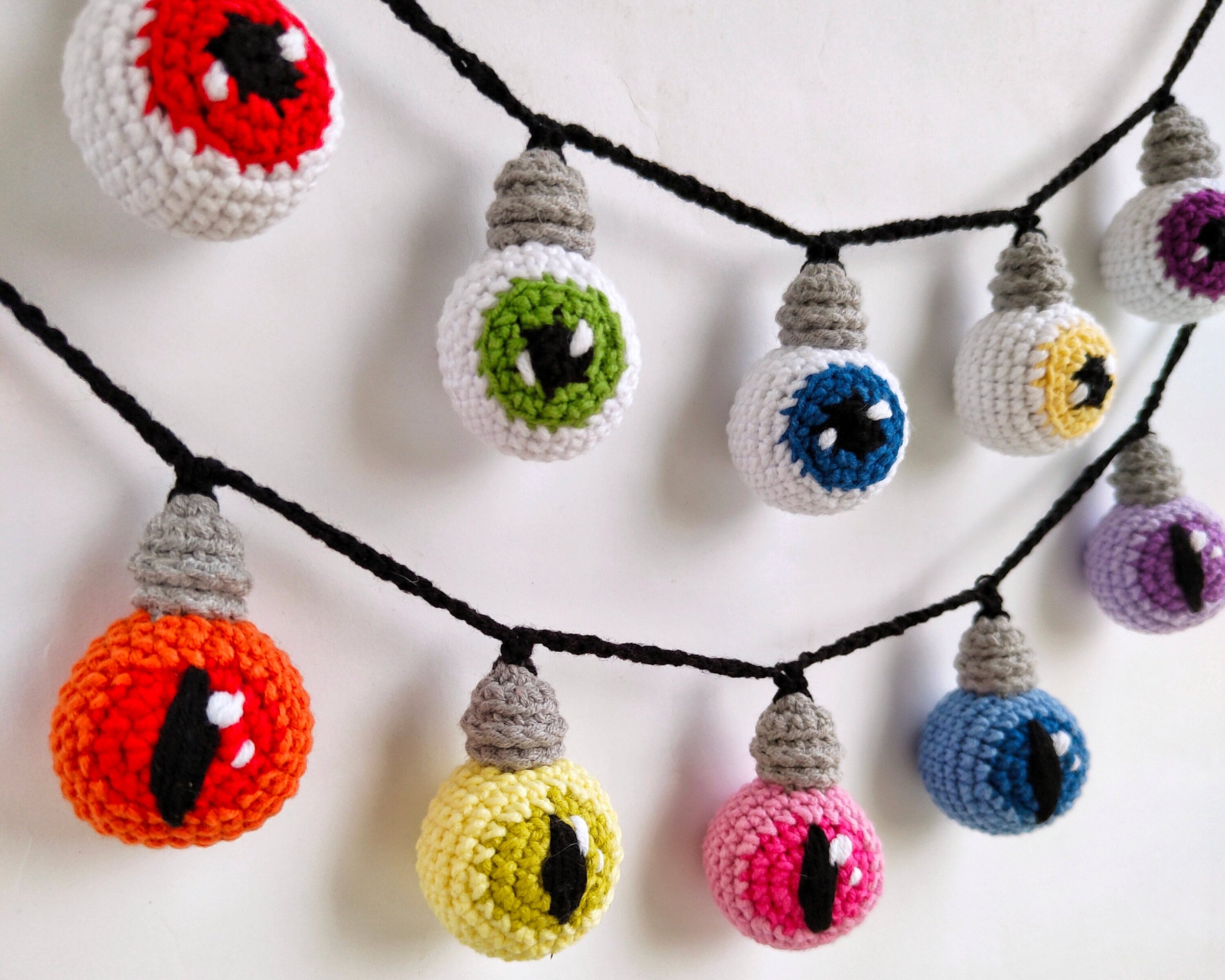 40 Eye Crochet Patterns: Mesmerizing Designs for Every Crochet Enthusiast 23 Crochet Eyeball Light Bulb Garland Pattern: Halloween