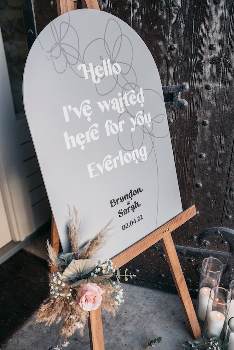 Modern boho wedding invitation suite. Featuring elegant curved shapes and a subtle floral design, this collection can be adapted to your colours. Arch shape welcome sign featuring song lyrics and couples names and wedding date.