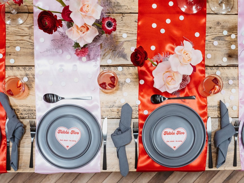 The ultimate red and pink wedding stationery! Featuring a bursting heart design, retro font and fun wording, this is the Malibu collection. On the day stationery including heart shape place cards, menus, table numbers, welcome signs and table plans.