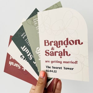 Modern boho wedding invitation suite. Featuring elegant curved shapes and a subtle floral design, this collection can be adapted to your colours. Includes a save the date, invitation, information card and rsvp. On the day stationery also available.