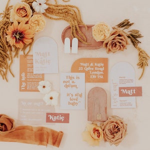 Modern boho wedding invitation suite. Featuring elegant curved shapes and a subtle floral design, this collection can be adapted to your colours. Includes a save the date, invitation, information card and rsvp. On the day stationery also available.