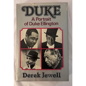 May include: A hardcover book titled Duke: A Portrait of Duke Ellington by Derek Jewell. The grey cover features four black and white photographic portraits of Duke Ellington in various attire, including a top hat and a fedora, arranged in a grid.