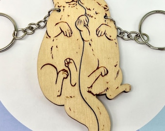 Bedeutende Otter, Otterpaar-Schlüsselanhänger aus Holz für Freundschaft